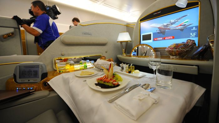 A meal setting in a first class seat abo
