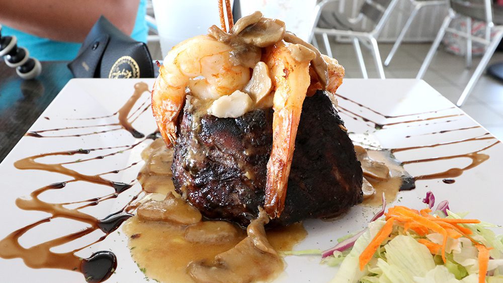The sensational Volcano Surf & Turf, a Puerto Rican dish at Costa Mia Restaurant in Fajardo, consisting of a large, tender steak with shrimp, mushrooms, and gravy
