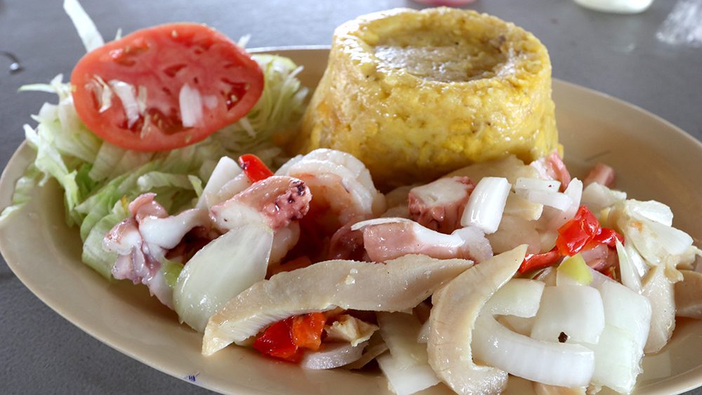 One of the most well-known Puerto Rican foods, mofongo, made with mashed plantains, vegetables, meat, and/or seafood