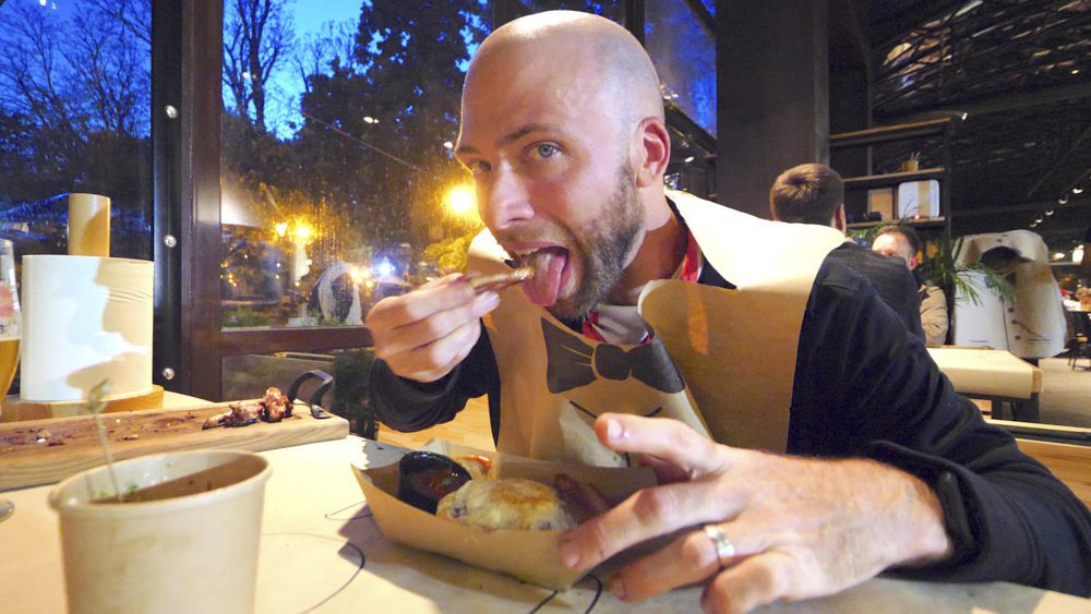 David Hoffmann eating the Potato Egg Bacon Monster at Rebernia Restaurant