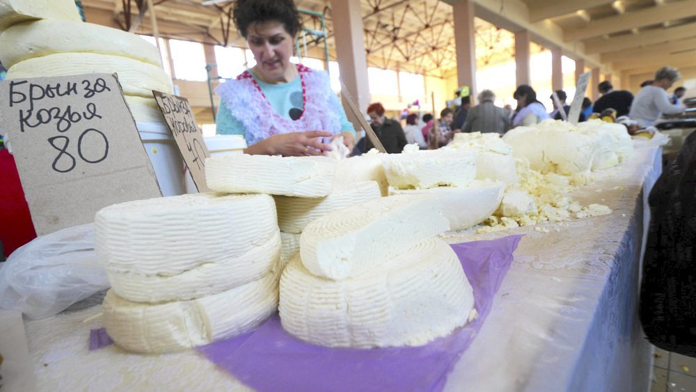 A vendor selling cheese 