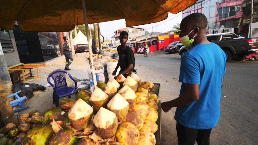 A coconut vendor in Accra, Ghana
