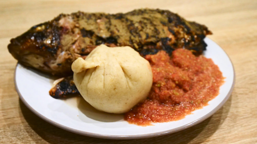 Banku with grilled fish and shito in Accra, Ghana
