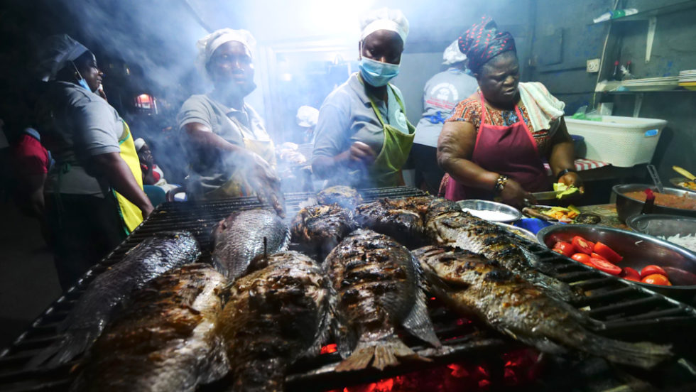 Grilled catfish vendors in Accra, Ghana