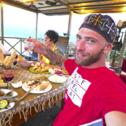 David Hoffmann enjoying a meal and drinks at Qilimcha's Guesthouse in Telavi, Georgia