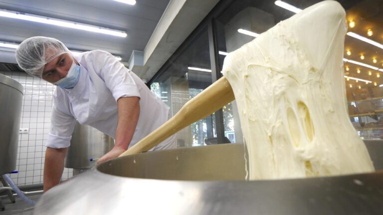 A cook preparing sulguni cheese at Tserti Restaurant in Tbilisi, Georgia