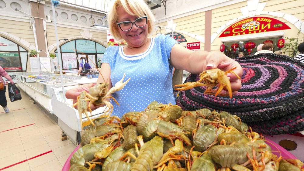 A vendor showing off her live crayfish in Privoz Market in Odessa, Ukraine
