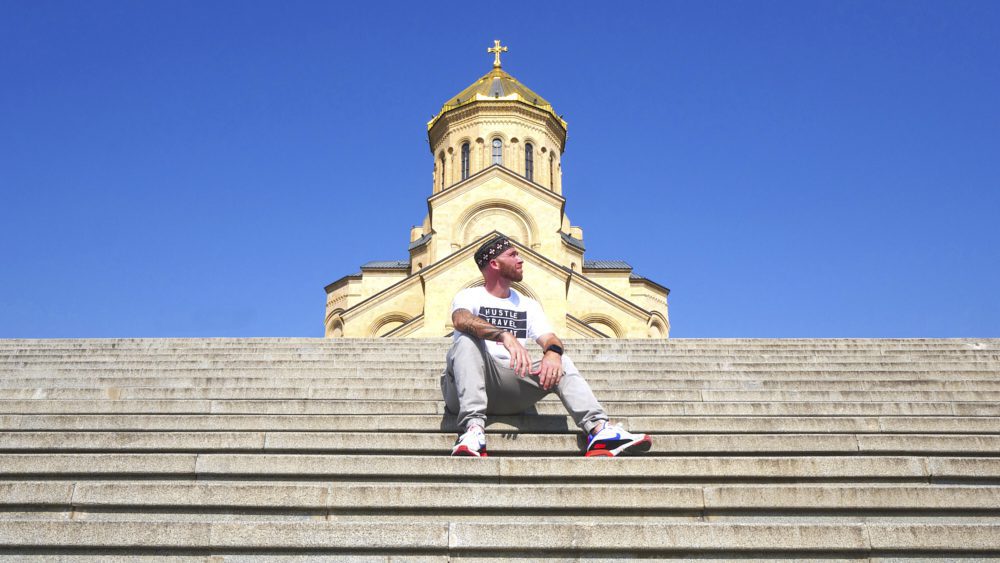 David Hoffmann admiring the view from the steps in front of Trinity Cathedral in Tbilisi, Georgia