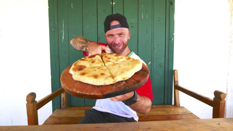 David Hoffmann showing off a freshly baked kubdari at Oasis Club in Udabno, Georgia