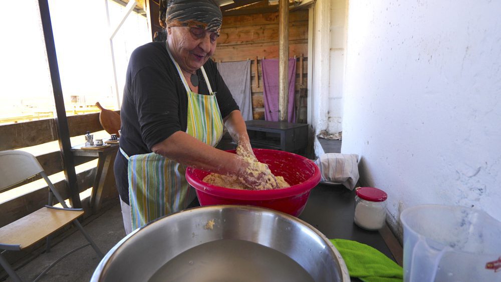 A local woman preparing the dough for kubdari in Kakheti, Georgia