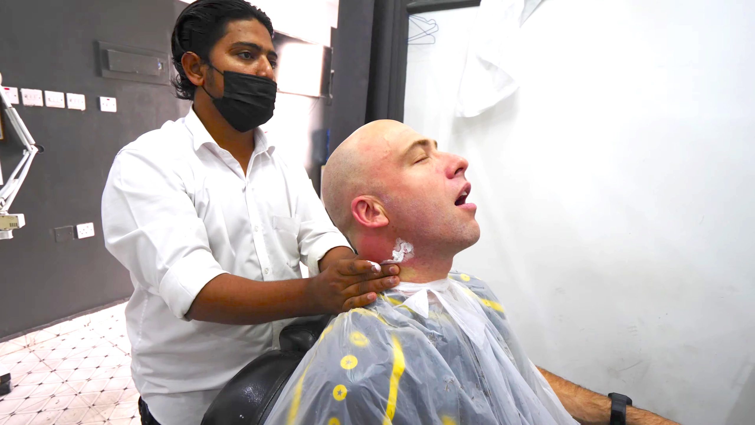 Enjoying a relaxing Pakistani haircut and massage in Muscat, Oman