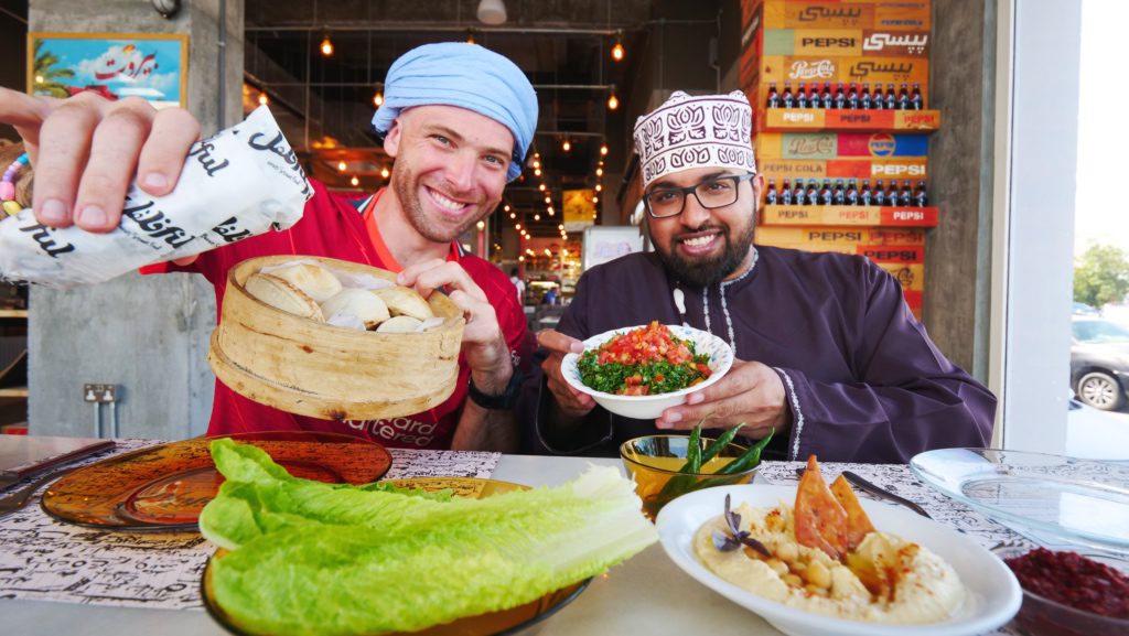 Me and my guide Ahmed enjoying a meal in Muscat, Oman