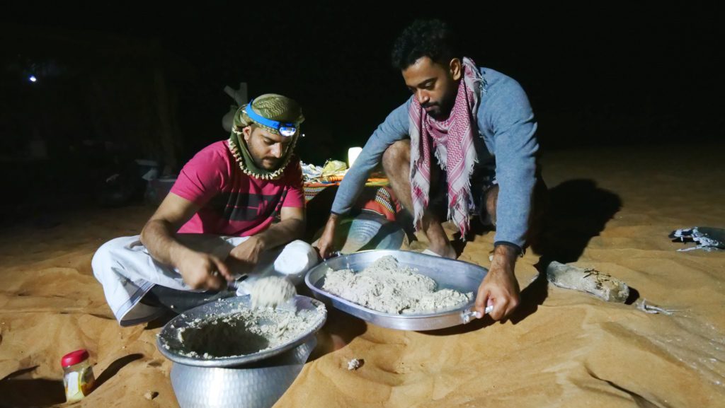Cooking Bedouin food in the desert of Oman