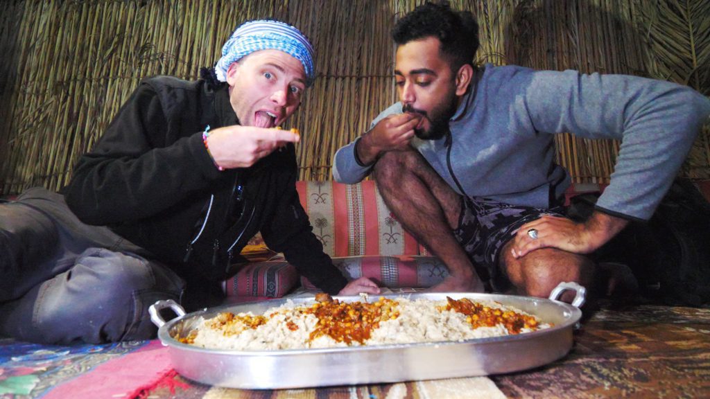 Eating orsia and liver curry in the Wahiba Sands