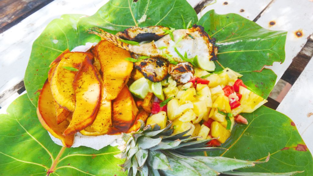 Barbecued lionfish, pineapple salad, and roasted breadfruit off the coast of Pigeon Point, Tobago | David's Been Here