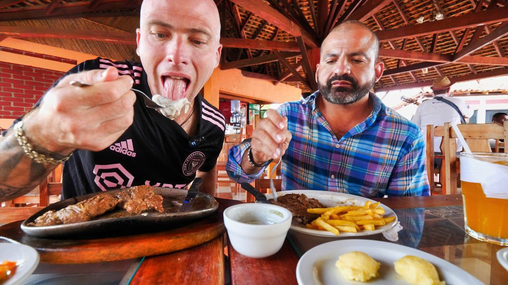 My guide Carlos and I enjoying grilled beef at La Plancha II in Managua, Nicaragua | David's Been Here