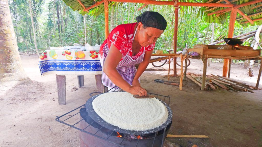 A local woman makes cassava bread in Moraikobai, Guyana | Davidsbeenhere