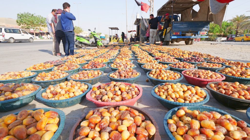 Vendors selling dates along the pilgrimage route in Karbala, Iraq | Davidsbeenhere