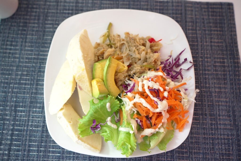 Saltfish, salad, and roasted breadfruit in Dominica | Davidsbeenhere