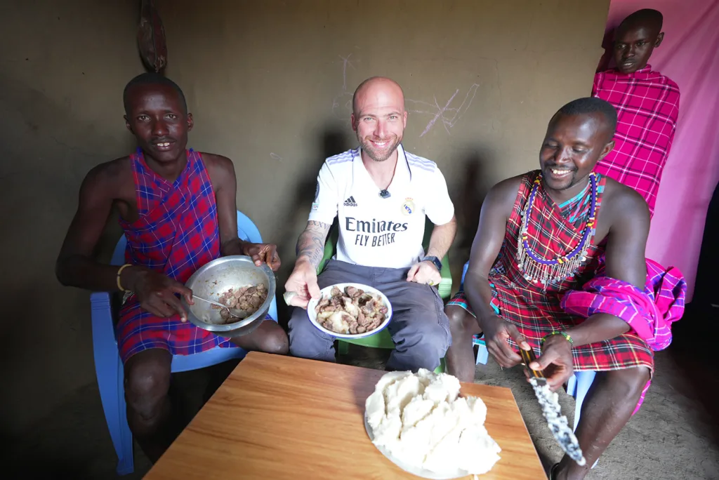 Dining on lamb and ugali with Maasai tribe | Davidsbeenhere
