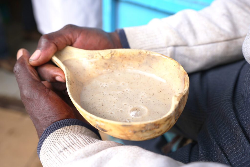 A gourd shell filled with uji, a nutritious millet porridge in Nairobi, Kenya | Davidsbeenhere
