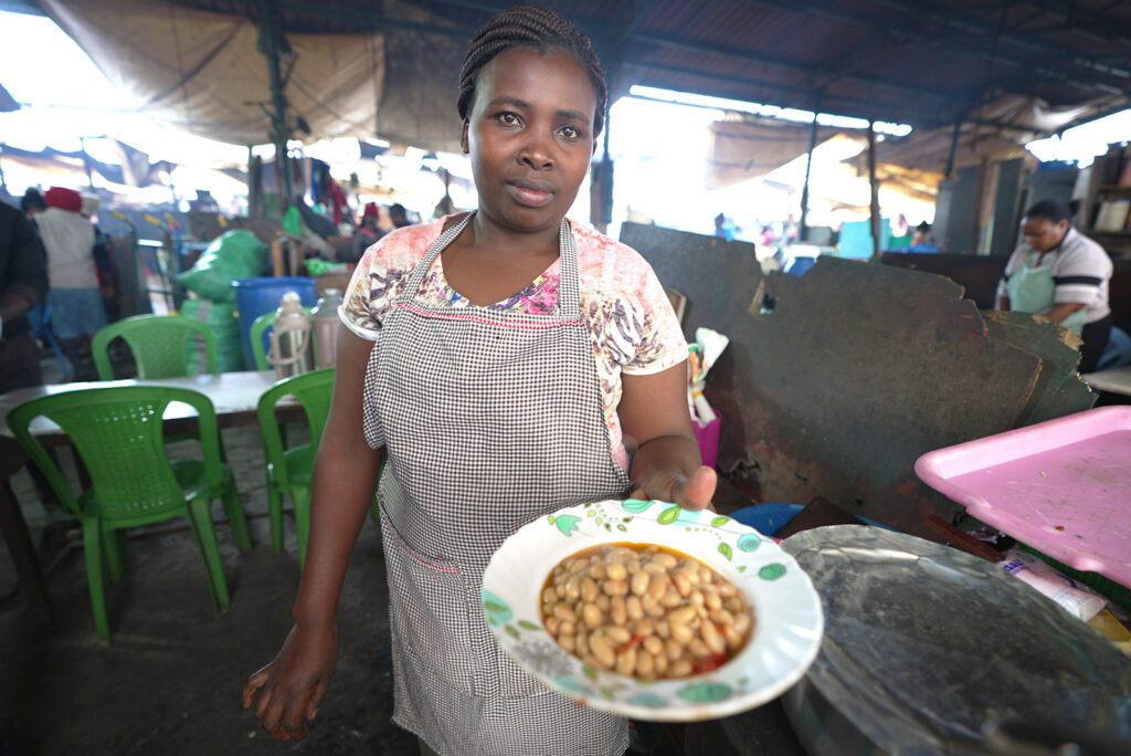 A local woman serving githeri in Muthurwa Market | Davidsbeenhere