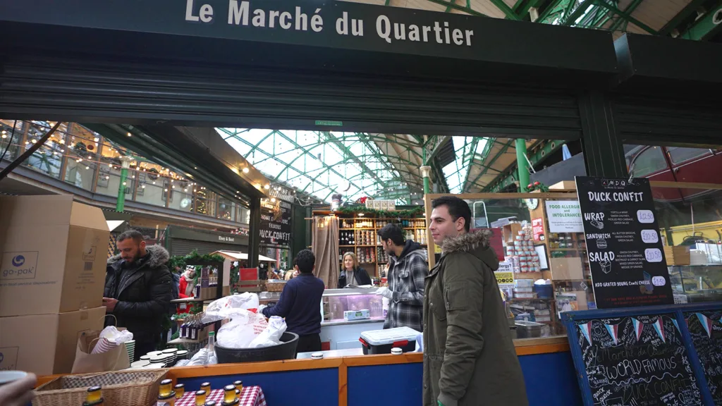 My guide Neema waiting to place an order at Le Marche du Quartier | Davidsbeenhere