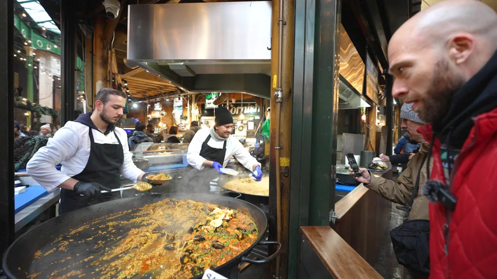 A trader at a Spanish booth preparing paella | Davidsbeenhere