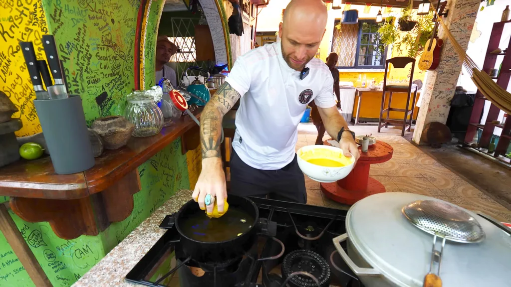 David Hoffmann dipping a freshly battered egg ball into a pot of hot oil at the Backyard Café | Davidsbeenhere