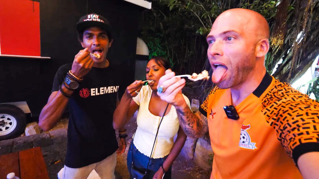David Hoffmann and his guides Craig and Nerissa eating Bailey's Cheesecake from Bella's Desserts | Davidsbeenhere