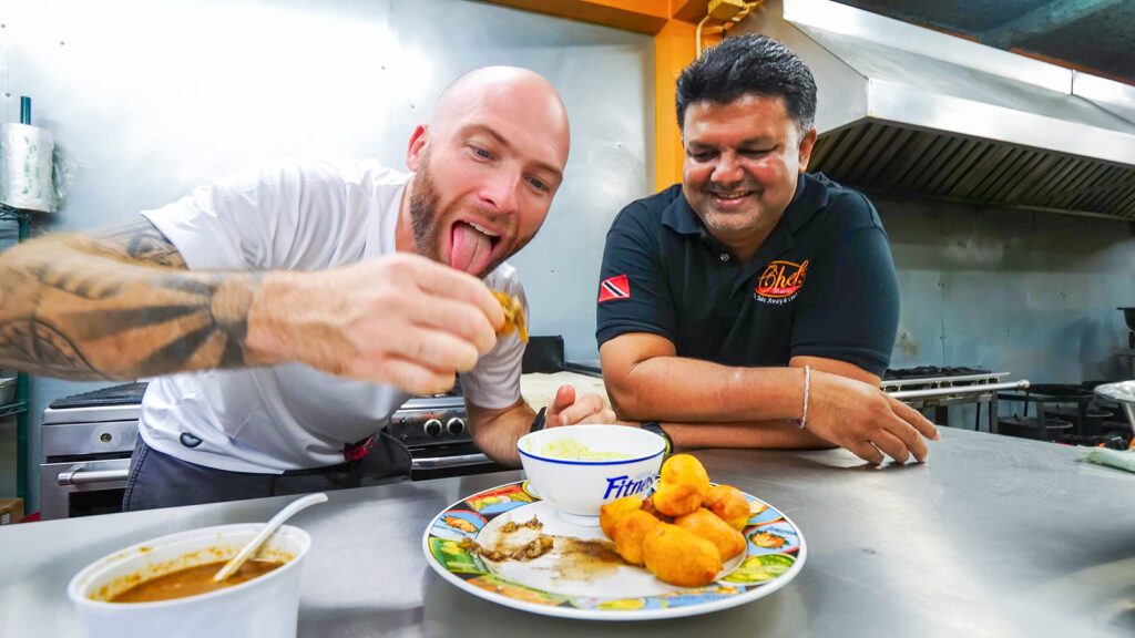 David Hoffmann eating pholourie with Chef Sharaz at Cassie's Creations | Davidsbeenhere