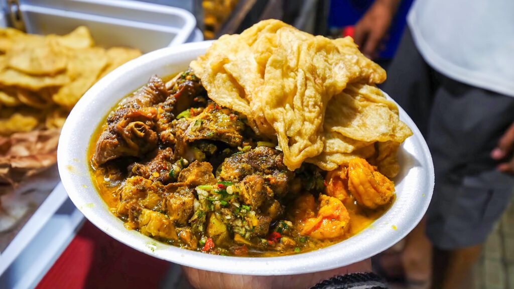 Gourmet Trinidad doubles, consisting of bara, chana, curry duck, goat, shrimp, and more | Davidsbeenhere
