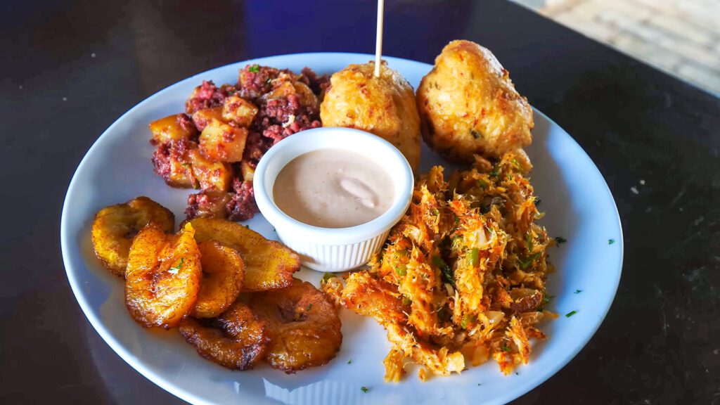 A traditional Bajan breakfast of sailfish, fish cakes, fried plantains, bakes, and corned beef hash in Barbados | Davidsbeenhere