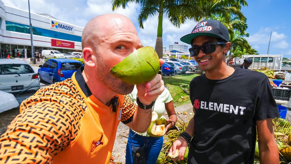 David Hoffmann and his guide Craig enjoying fresh coconuts in Barbados | Davidsbeenhere