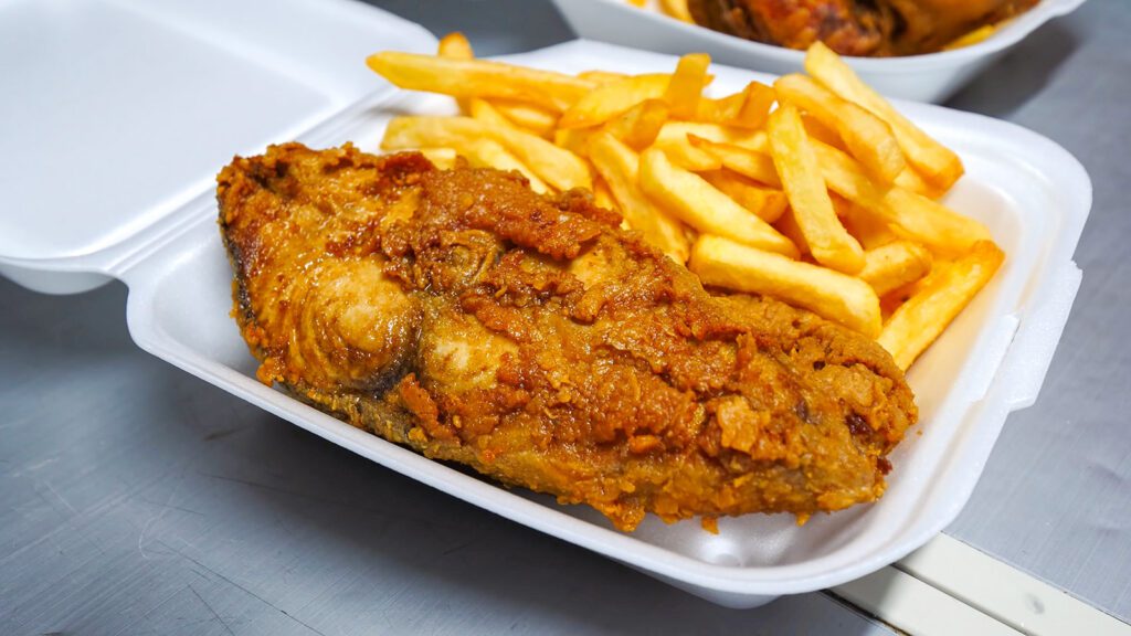 A styrofoam container of fried kingfish and fries in Canaan, Tobago | Davidsbeenhere