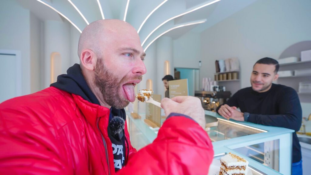 David Hoffmann takes a bite of a scrumptious carrot cake in Rotterdam | Davidsbeenhere
