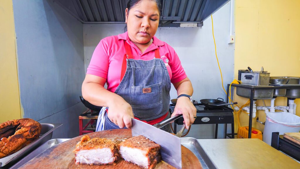 The Queen of Pork prepares a pork mountain at Quan Kep's Pork Shed | Davidsbeenhere