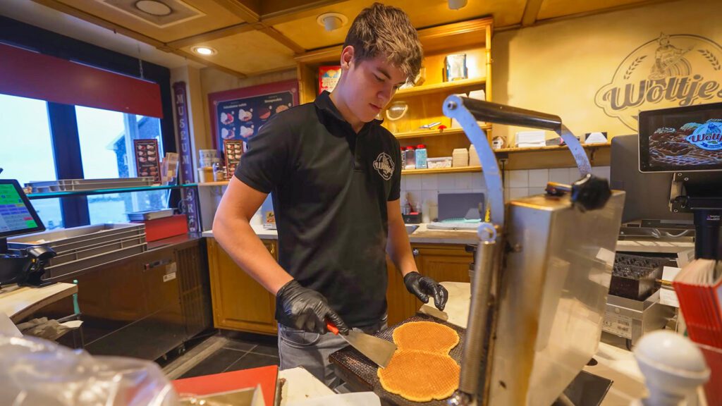 A cook at Woltje's prepares fresh stroopwafels | Davidsbeenhere