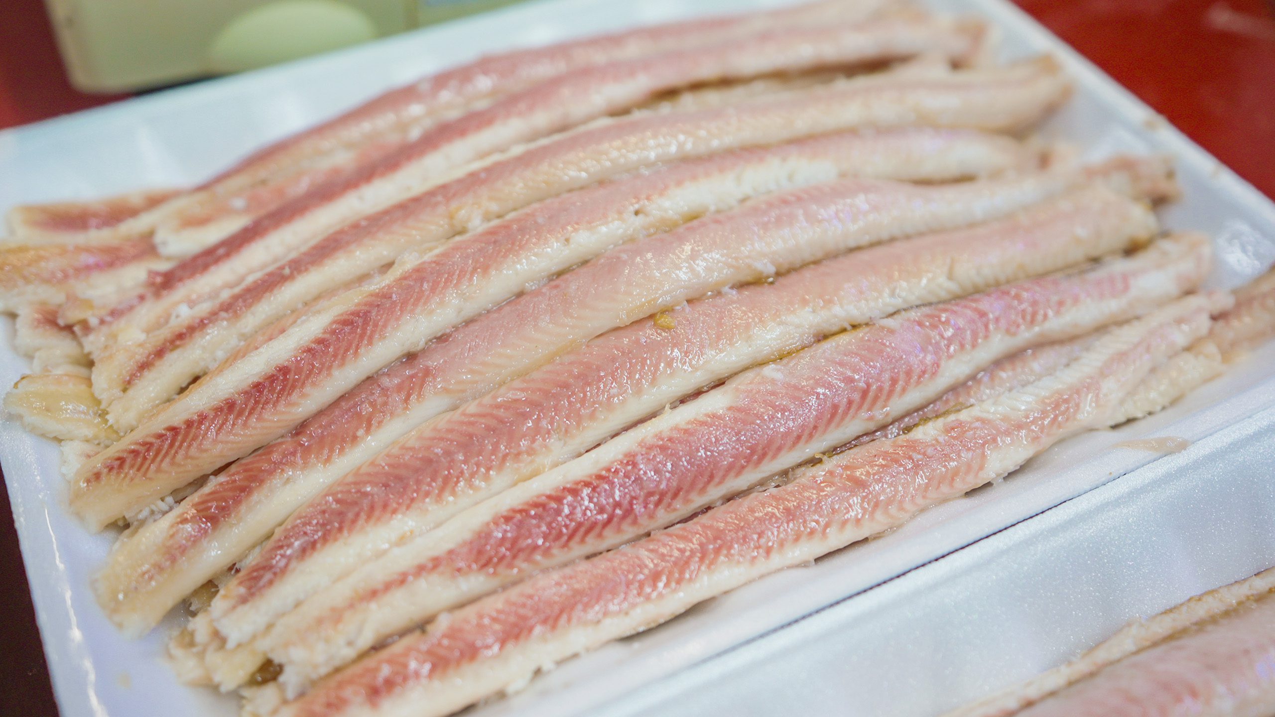 A tray full of fresh smoked eel in Volendam, the Netherlands | Davidsbeenhere