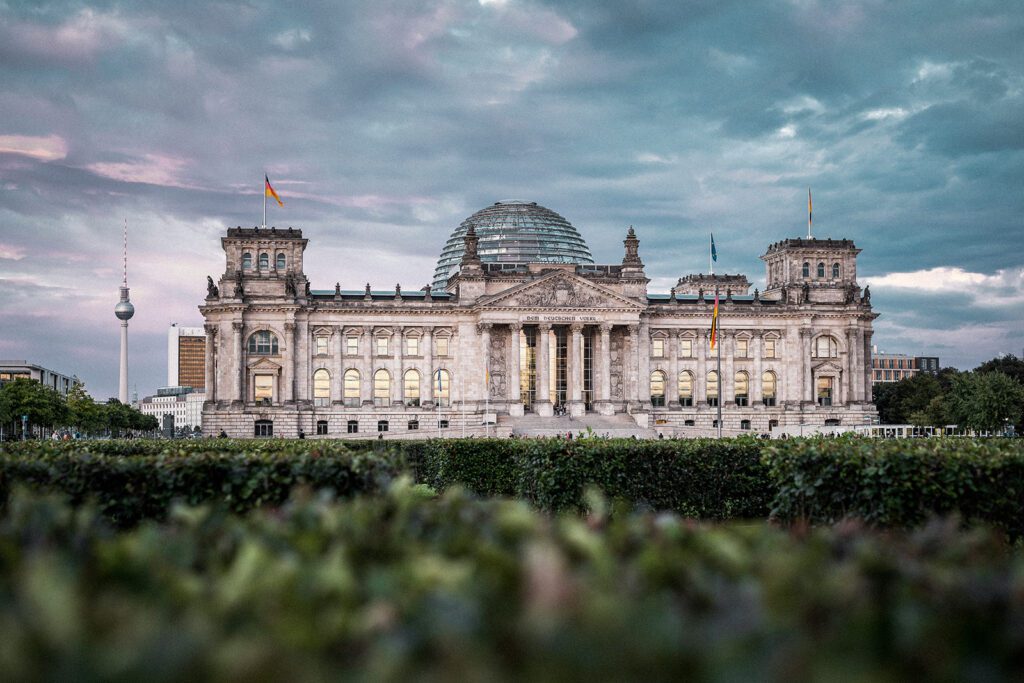 The Reichstag Building, with its iconic facade and glass dome on display | Davidsbeenhere