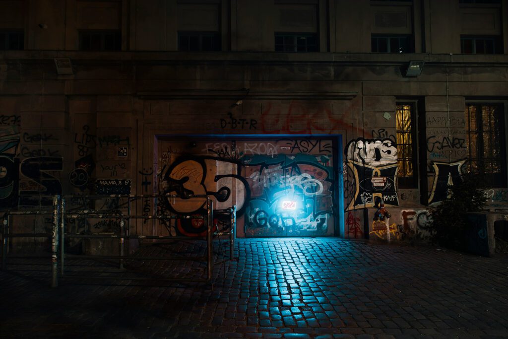 The graffiti-covered entrance of Berghain, one of the best things to do in Berlin, Germany | Davidsbeenhere