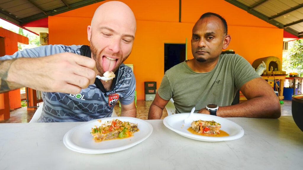 David Hoffmann eating snapper with tomatoes in Caura, Trinidad | Davidsbeenhere
