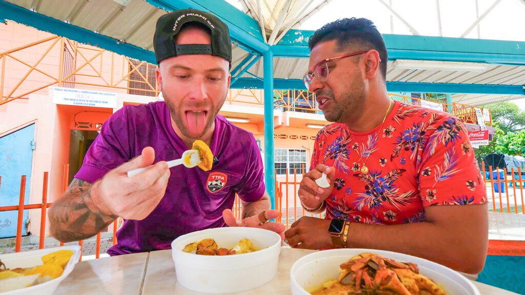 David Hoffmann and Chef Jason Peru enjoy curry crab, dumplings, callaloo, and other Tobagonian favorites at Miss Trim's | Davidsbeenhere