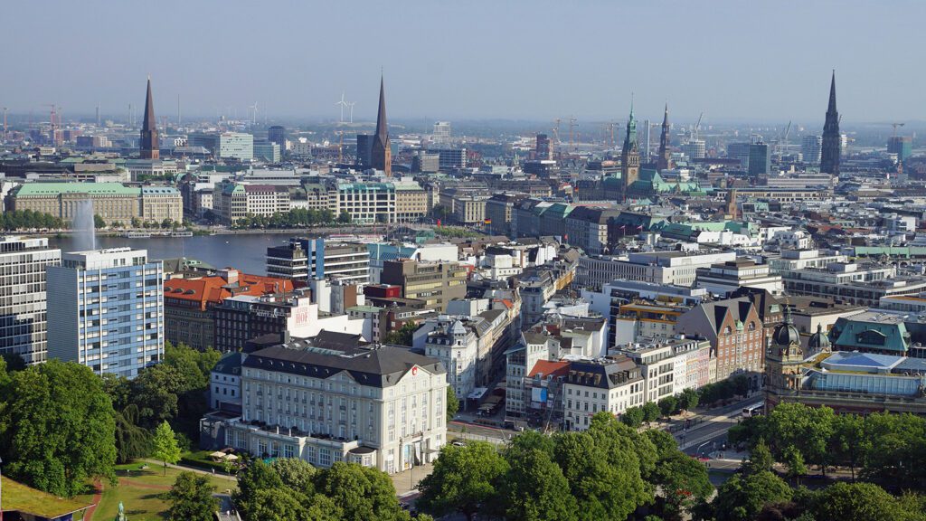 Aerial view of the city of Hamburg, Germany, with numerous buildings including several churches | Davidsbeenhere