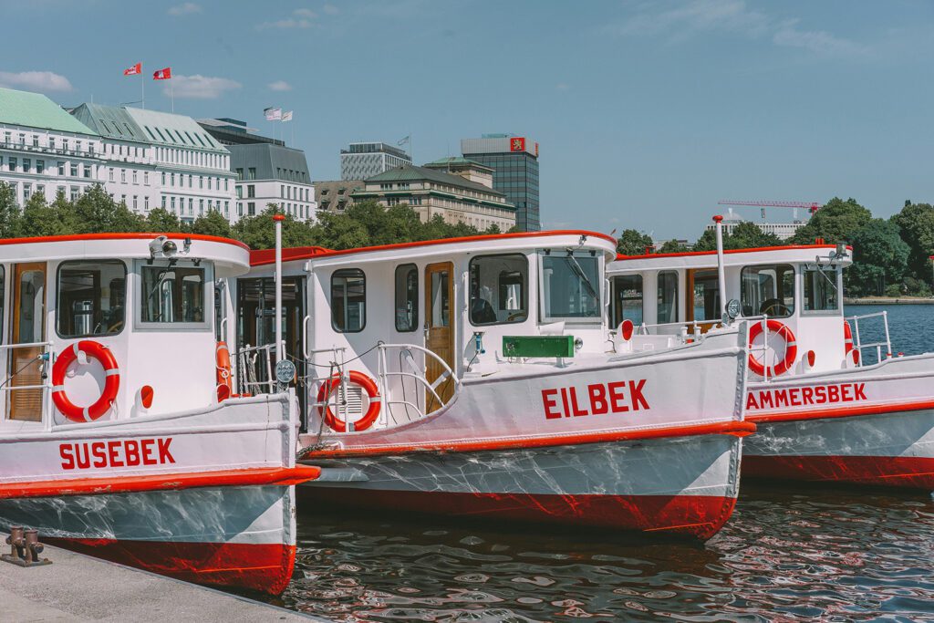 Three boats floating on a waterway, one of the top things to do in Hamburg | Davidsbeenhere