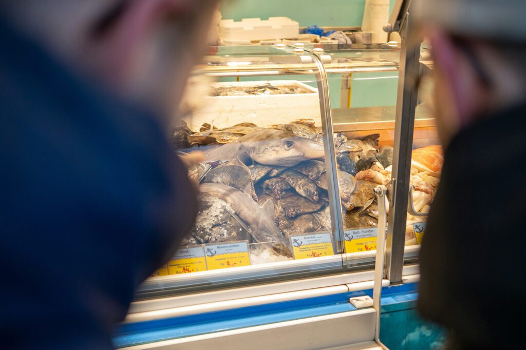 A display case of fresh fish at Fischmarkt, one of the top things to do in Hamburg | Davidsbeenhere