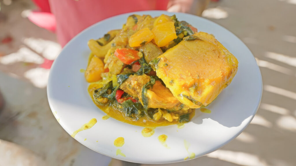 Oil down, a Grenadian stew made from fish, chicken, pork, and other seafood, along with breadfruit and other root vegetables | Davidsbeenhere