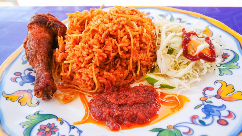 A food in Ghana called jollof rice, a flavorful rice dish that has many variations across West African | Davidsbeenhere