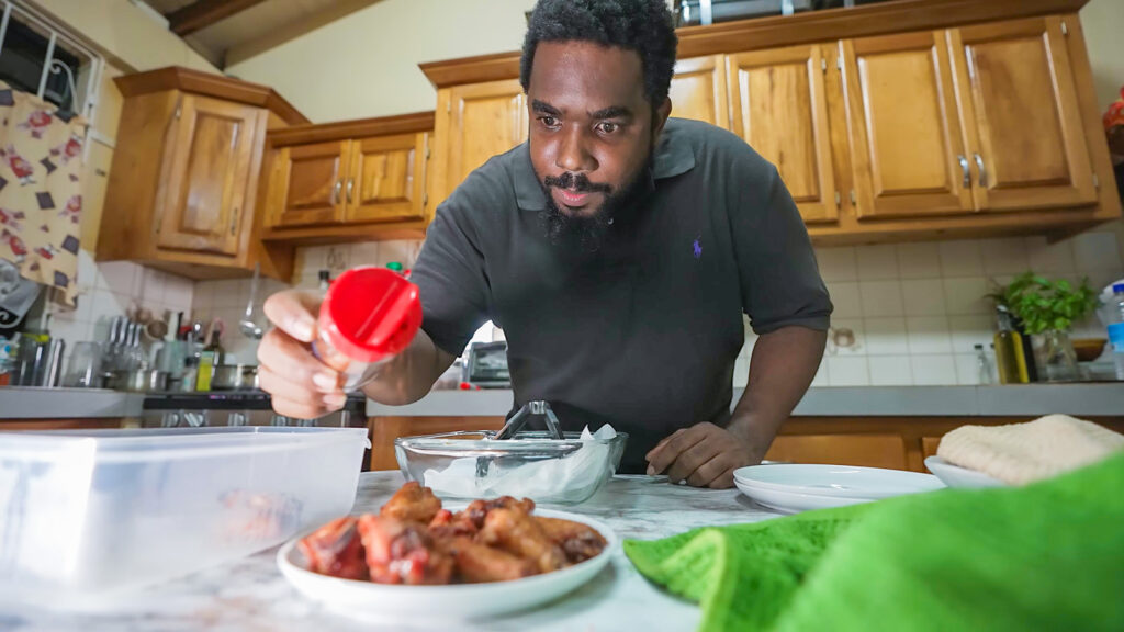 Larry seasons some delicious chicken wings in his home kitchen | Davidsbeenhere