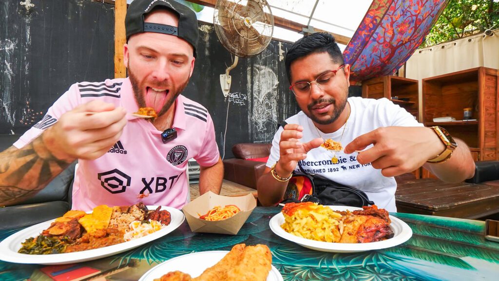 David Hoffmann and Chef Jason Peru enjoy the Haitian cuisine at Naomi's Garden in Miami | Davidsbeenhere